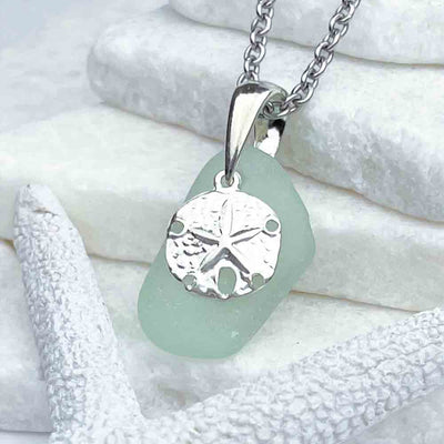 This Crisp Ice Aqua Sea Glass Pendant Pairs Beautifully with a Sand Dollar Charm|View the entire collection of guaranteed authentic Sea Glass! Real Sea Glass Necklaces | Bracelets | Earrings | Rings | Rare Colors Our Specialty | 30+ Years Experience